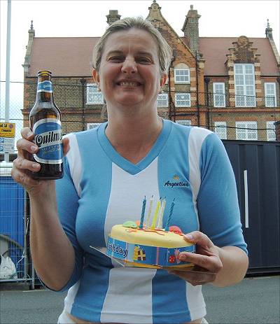 Patricia with beer and birthday cake