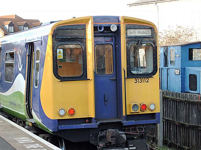 Class 313 train showing North Woolwich destination