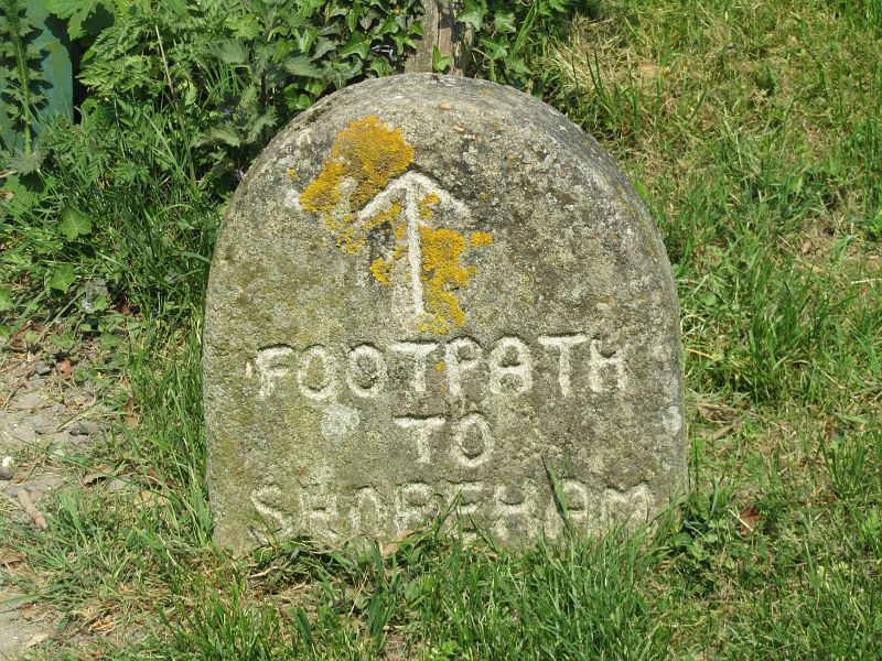 old stone footpath sign