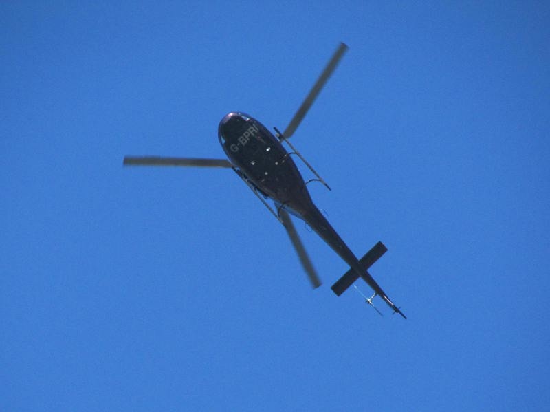 Underside of a black helicopter