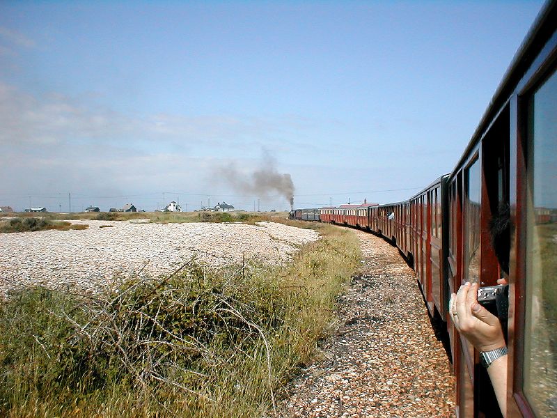 view from Romney, Hythe & Dymchurch railway carriage across the shingle near Dungerness