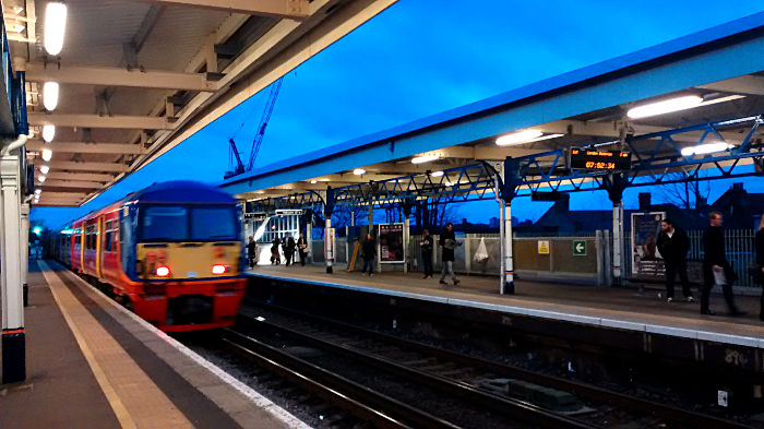 refurbished into SWT livery
                  class 456 train leaves Earlsfield