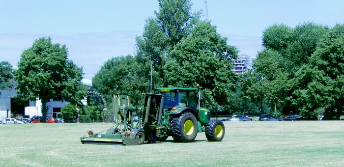 Tractor cutting the grass in St
                    George's Park