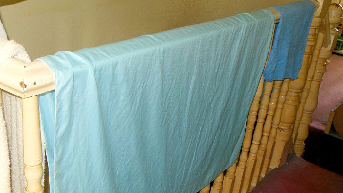 small table cloth, and small towel
                          drying over the banister rail