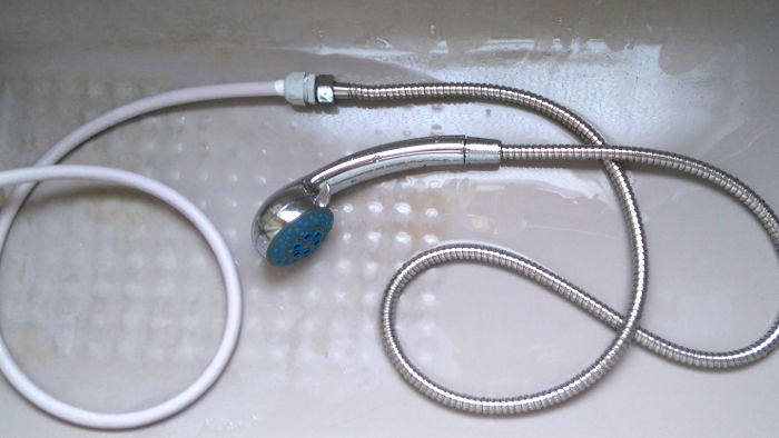 old and new shower
                          hoses connected together with a cable gland