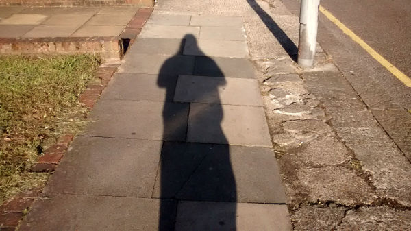 early morning sun
                          casting a long shadow