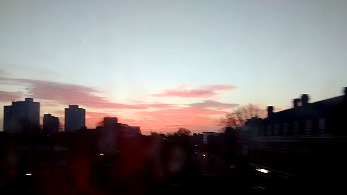 sunrise as seen from inside
                  a moving train
