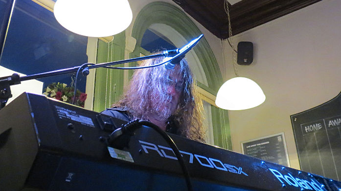 "artistic" shot of Dave at
                          his keyboards