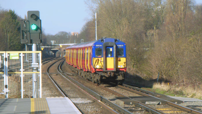 A class 455
                              train enters Earlsfield station