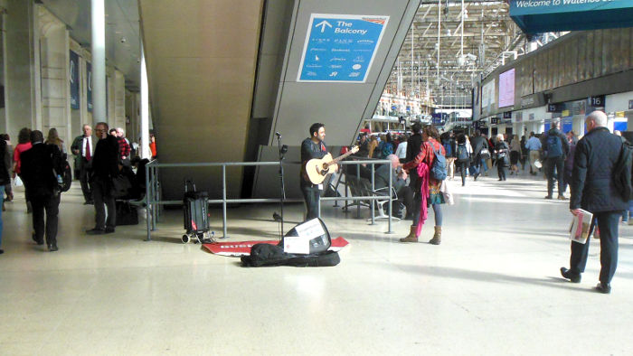 busker on Waterloo
                            station concourse
