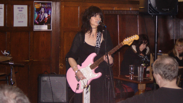 Jo Corteen and
                              her pink guitar