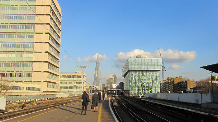 blue sky, fluffy
                              clouds, and The Shard