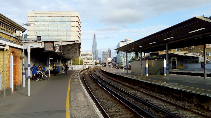 Waterloo East with The Shard
                  in the background