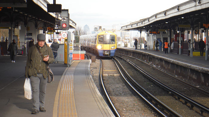 London Overground train
                  arriving at Clapham Junction