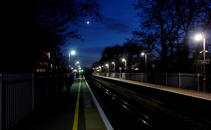 crescent moon over
                            Catford station at 16:40