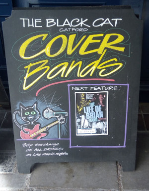 board outside The Black Cat