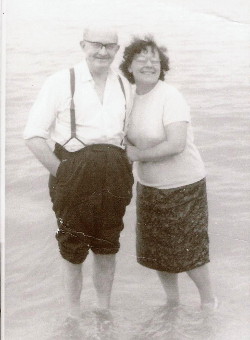 mum and dad paddling in the sea at
                      Leysdown