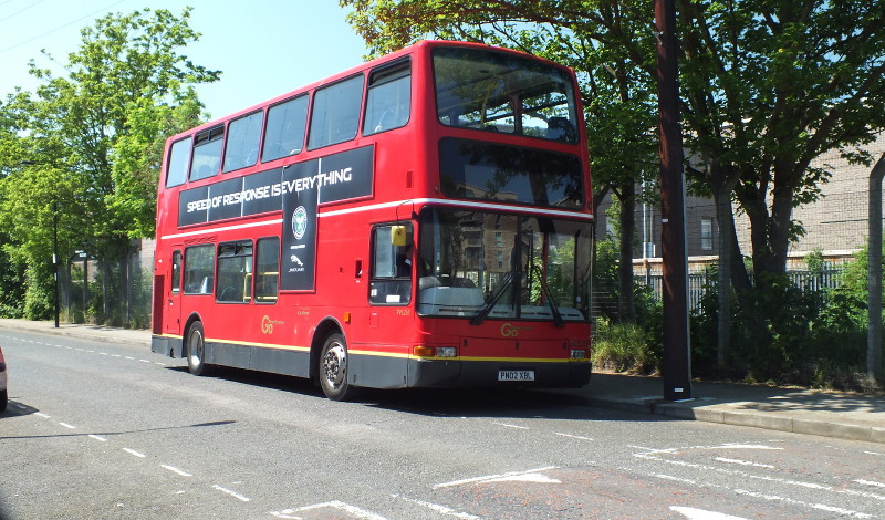 double decker red bus
                        near the park