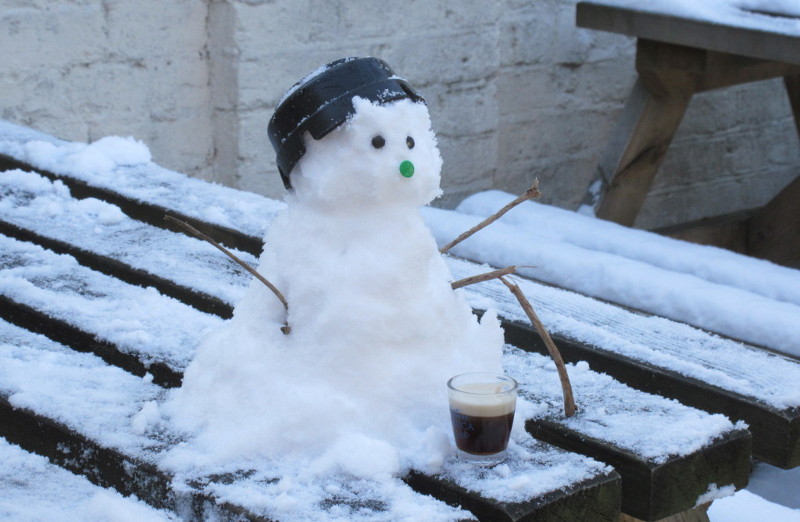 finished snowman with his glass of
                      Guinness