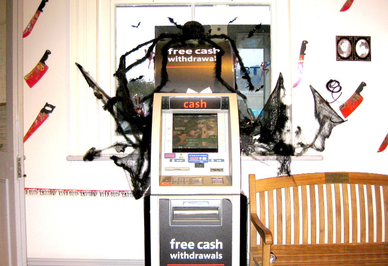 cash machine with spider on top