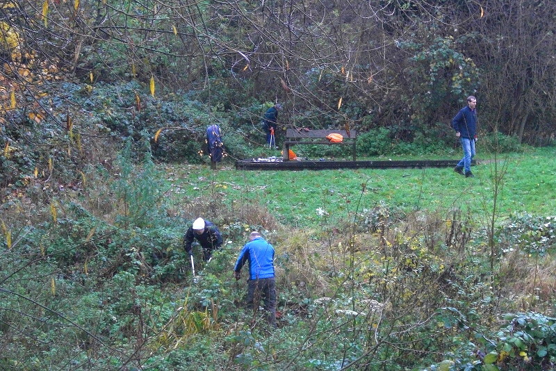 volunteers cleaning up
                        the river banks