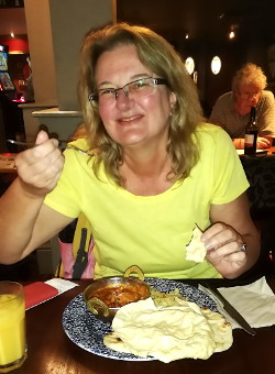 Patricia eating a Wetherspoons
                    curry