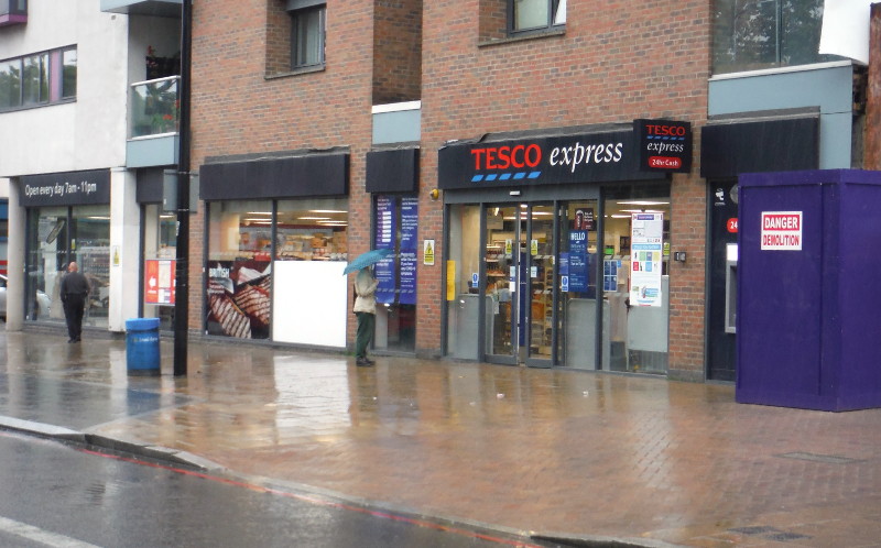 one person
                                  waiting outside Tesco Express