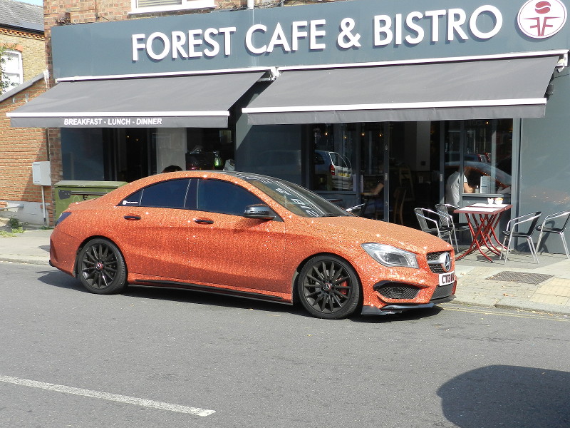 car covered in
                              orange glitter