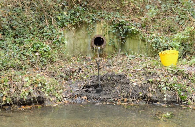 digging out
                                  a drainage outfall