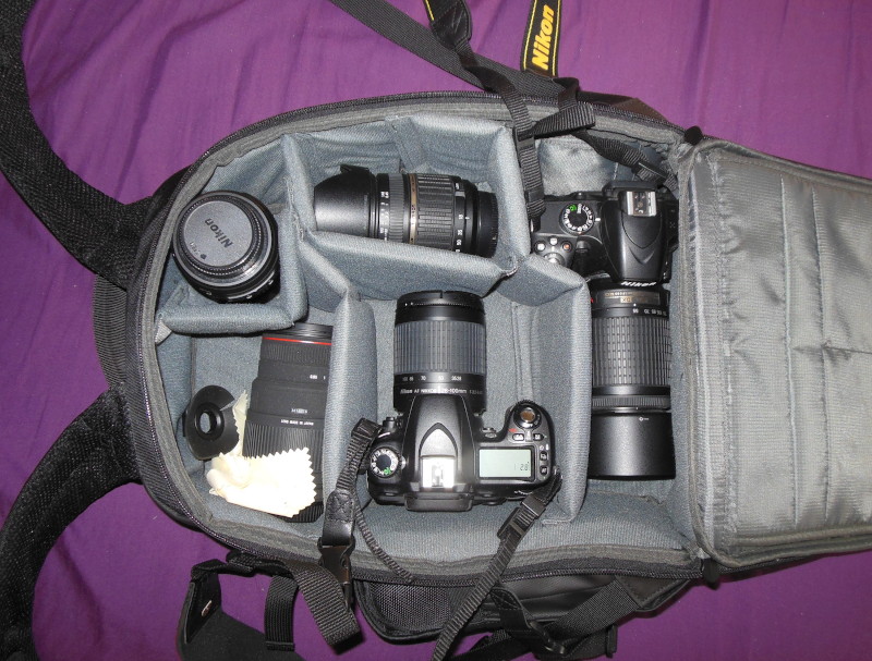 new back pack
                              stuffed with two cameras