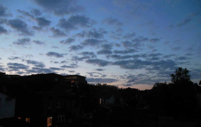 dark clouds against a
                                            dark blue sky