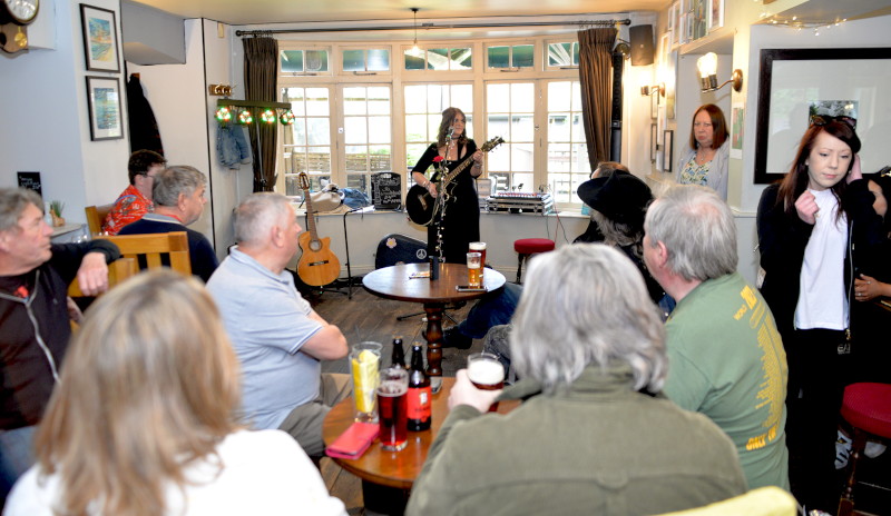 Long shot of Jo with
                                            audience in front