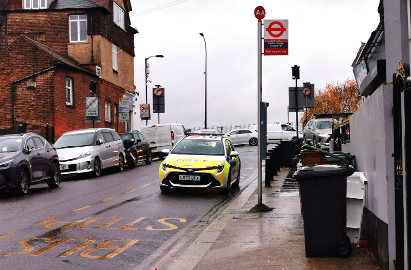 police car parked
                                                in a bus stop as the
                                                driver goes to buy
                                                coffee