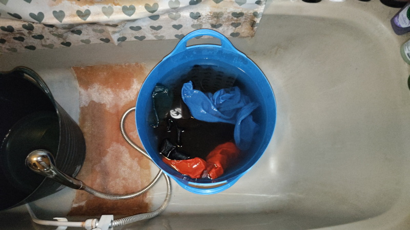 washing in a big bucket
                                          in the bath